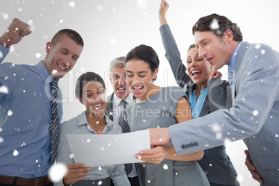 Composite image of business team celebrating a new contract