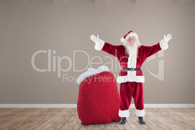 Composite image of happy santa with sack of gifts