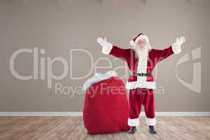 Composite image of happy santa with sack of gifts