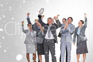 Composite image of excited business team cheering at camera with