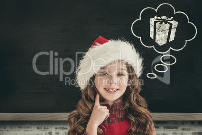 Composite image of cute girl in santa hat