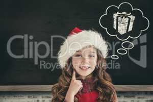 Composite image of cute girl in santa hat