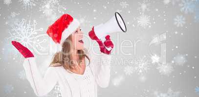 Composite image of festive blonde shouting through megaphone