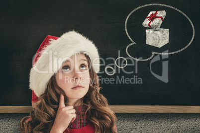 Composite image of cute girl in santa hat