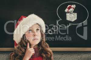 Composite image of cute girl in santa hat