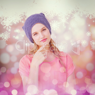Composite image of hipster woman with hat looking at camera