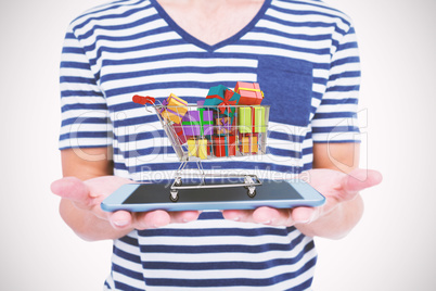 Composite image of close up of man holding tablet