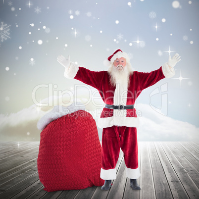 Composite image of happy santa with sack of gifts