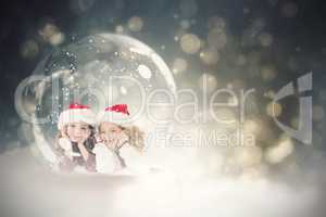 Composite image of festive child in snow globe