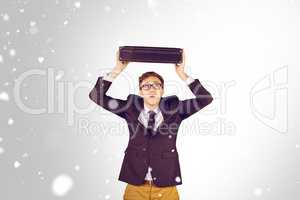 Composite image of young geeky businessman holding briefcase