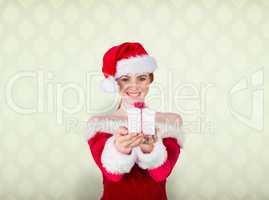 Composite image of pretty girl in santa costume holding gift box