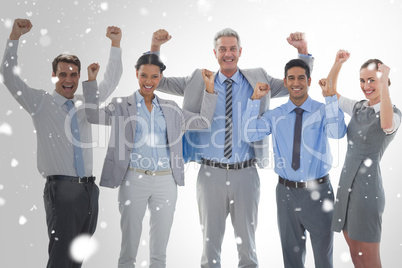 Composite image of business people cheering in office