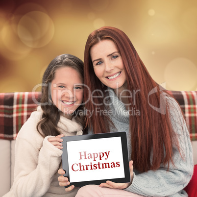 Composite image of mother and daughter showing tablet