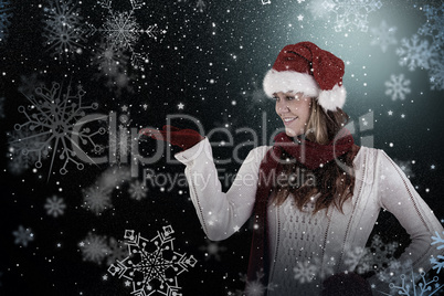 Composite image of festive blonde presenting with hand