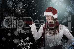 Composite image of festive blonde presenting with hand