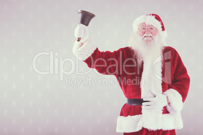 Composite image of santa claus rings his bell