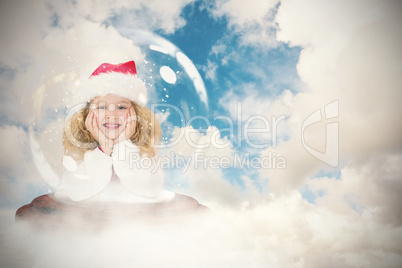 Composite image of festive child in snow globe