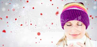 Composite image of delighted woman with a colorful hat and a cup