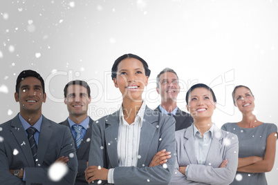 Composite image of business people looking up in office