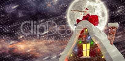 Composite image of santa sitting on roof of cottage