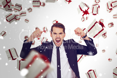 Composite image of furious businessman tensing arms muscle