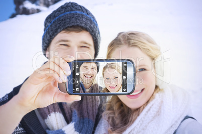 Composite image of hand holding smartphone showing