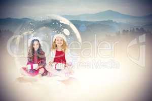 Composite image of festive child in snow globe