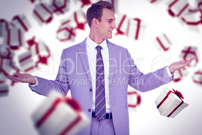 Composite image of businessman with hands out