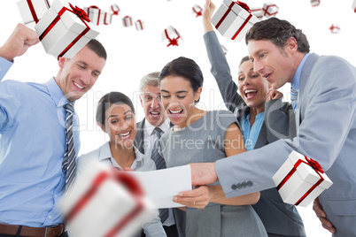 Composite image of business team celebrating a new contract