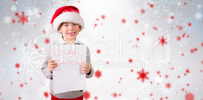 Composite image of festive boy showing letter