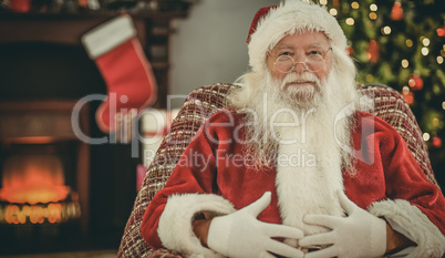 Portrait of santa holding his belly