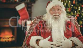 Portrait of santa holding his belly