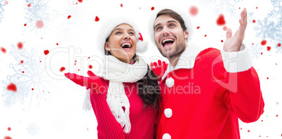 Composite image of festive young couple