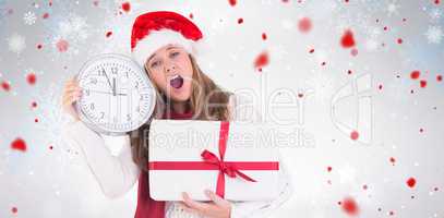 Composite image of festive blonde showing a clock and gift