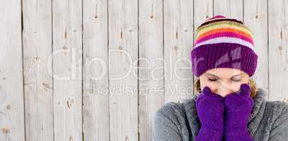 Composite image of freeze woman with gloves and a hat