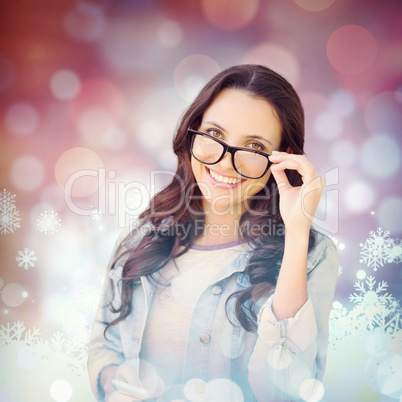 Composite image of brunette with smartphone