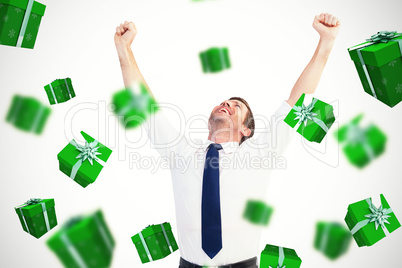 Composite image of cheering businessman