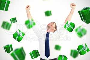 Composite image of cheering businessman