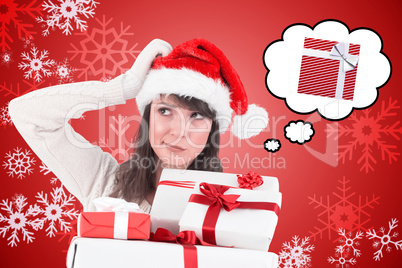 Composite image of santa woman scratching head and holding gifts
