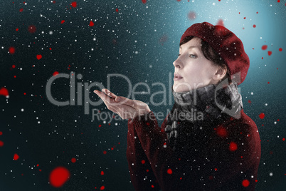 Composite image of woman blowing kiss from hands