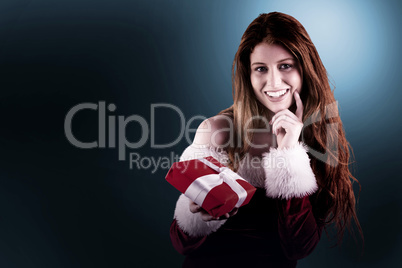 Festive redhead holding a gift