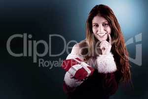 Festive redhead holding a gift