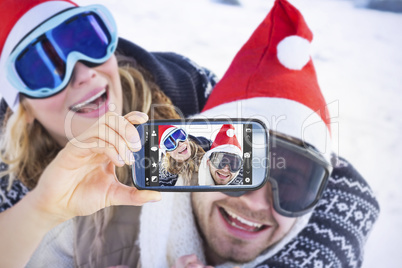 Composite image of hand holding smartphone showing