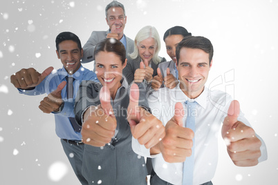 Composite image of happy business people looking at camera with