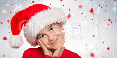 Composite image of festive little girl smiling at camera