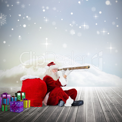 Composite image of santa looking through telescope