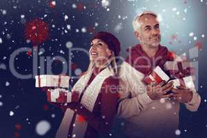 Composite image of happy festive couple with gifts