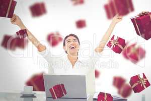 Composite image of businesswoman celebrating a great success