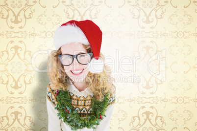 Composite image of geeky hipster smiling at camera