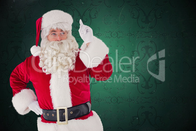 Composite image of serious santa claus pointing his finger